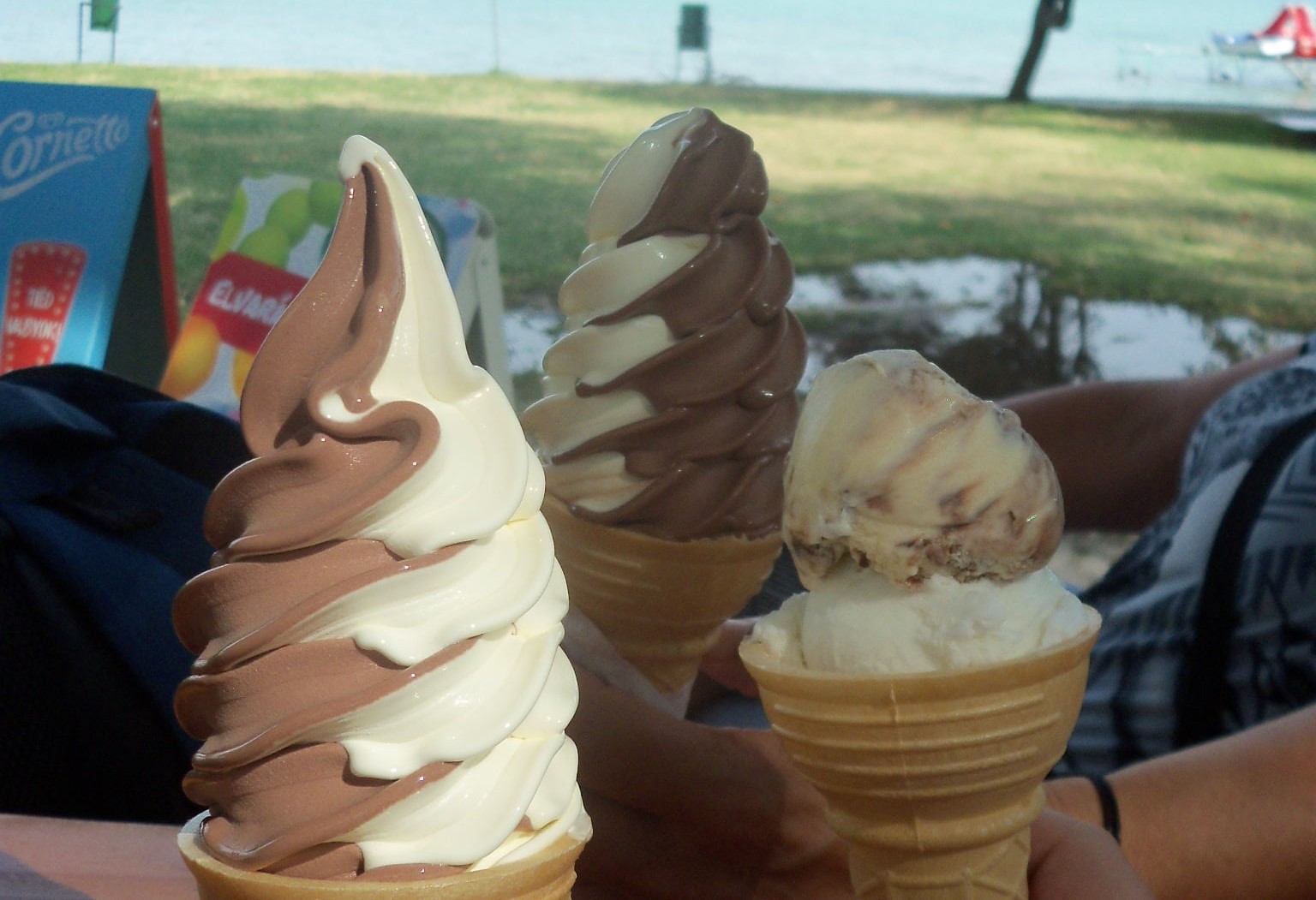 Travel with family. Three ice creams in three hands